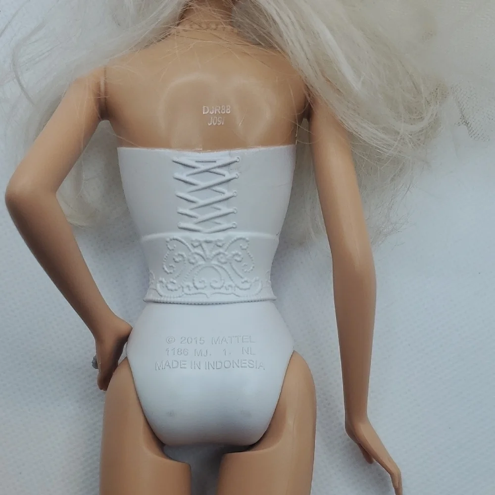 Mattel Dolls with Blonde Hair and Colorful Outfits